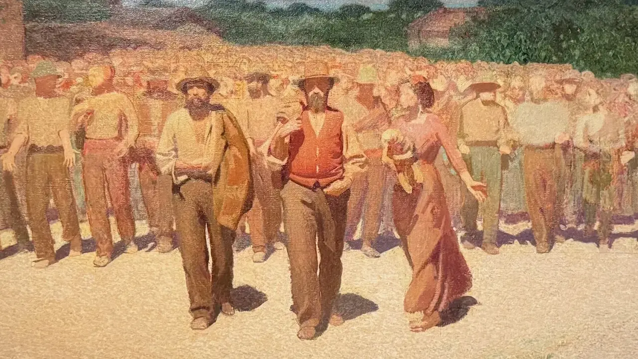 Un corteo di persone in abiti da lavoro, con un uomo in primo piano con gilet arancione. Un'immagine che evoca la vita e le tradizioni di Volpedo cosa vedere.