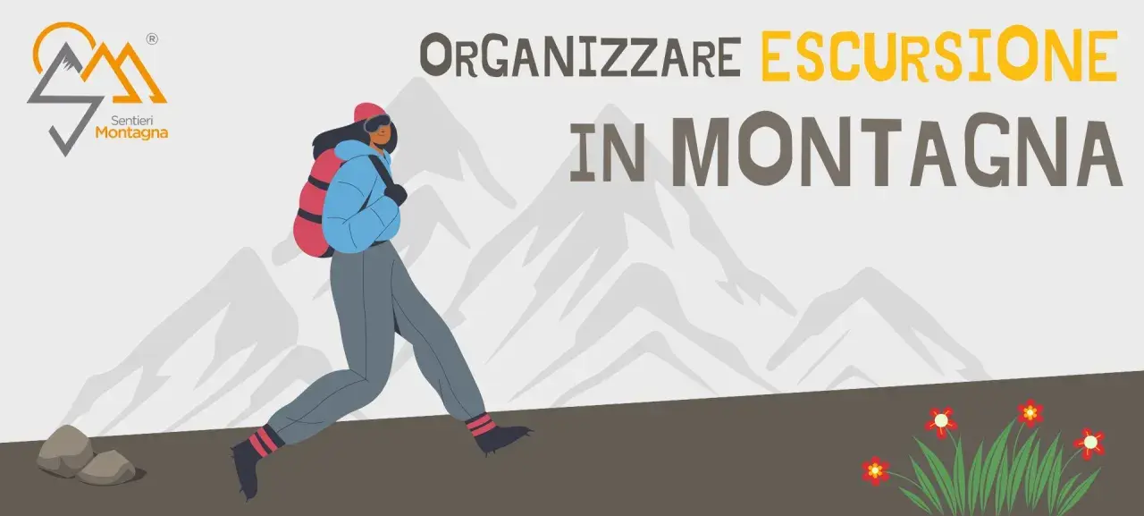 Organizzare un'escursione in montagna è un'avventura entusiasmante. Una persona con zaino cammina tra le vette innevate.