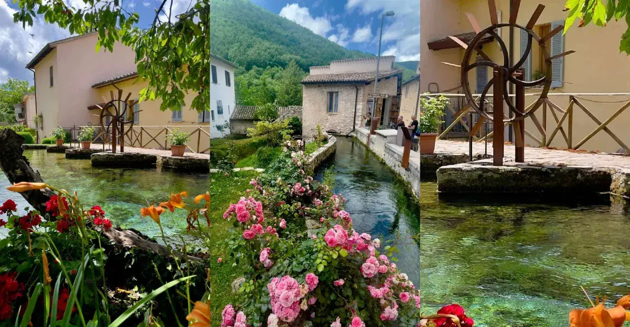 Borghi vicino Foligno: un ruscello attraversa un villaggio con mulini ad acqua, case antiche e fiori colorati.